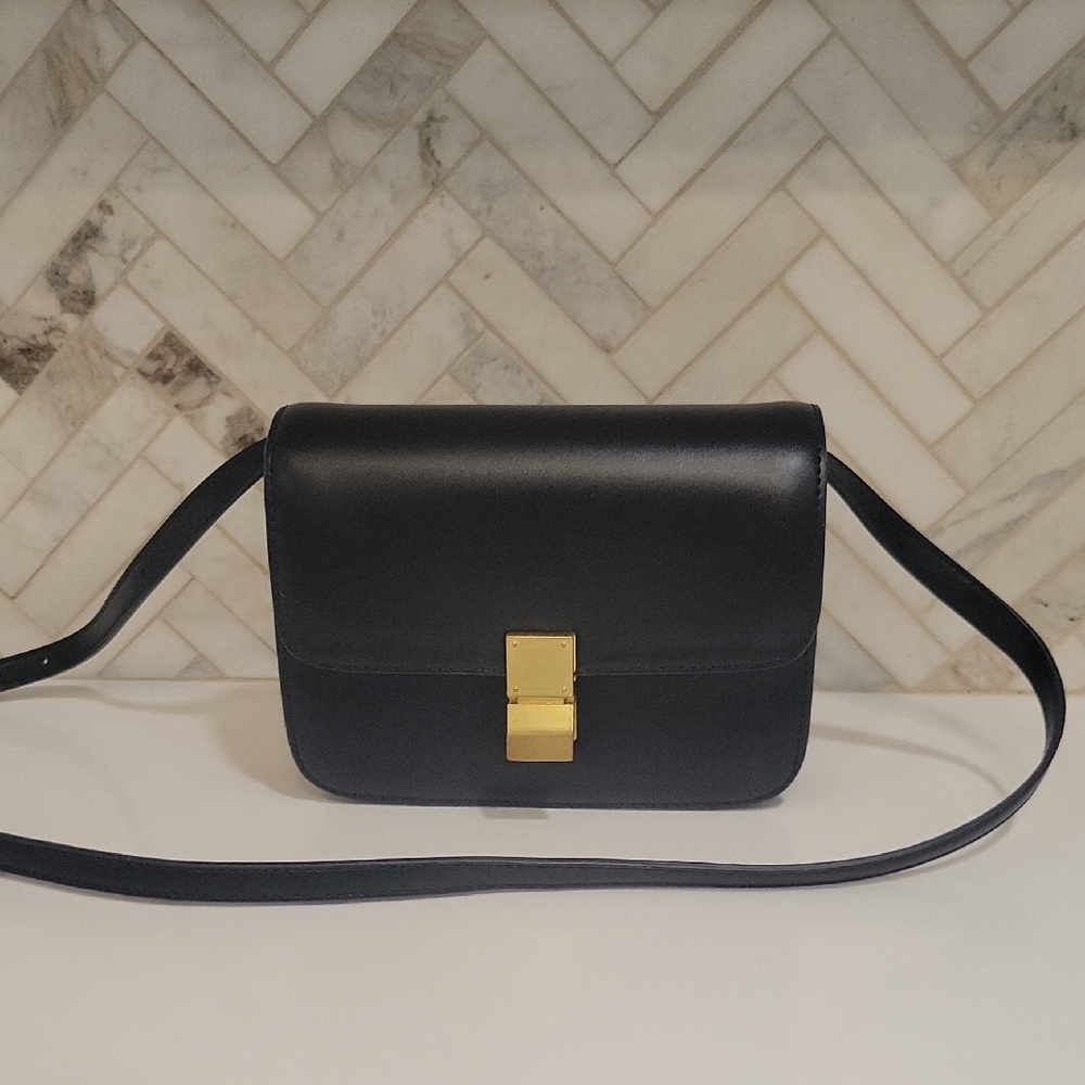 Black and Gold Crossbody Bag with Structured Design